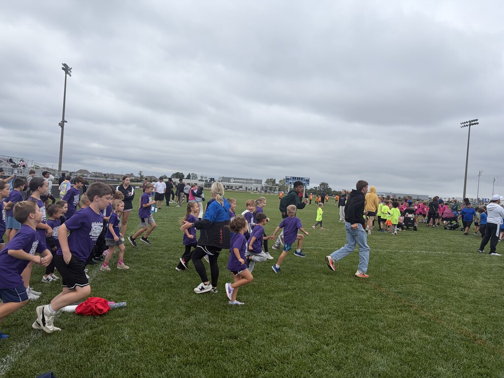 Kids running in the grass