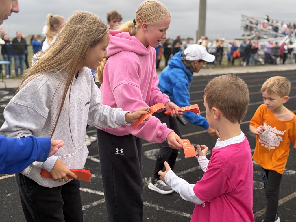 Handing out ribbons