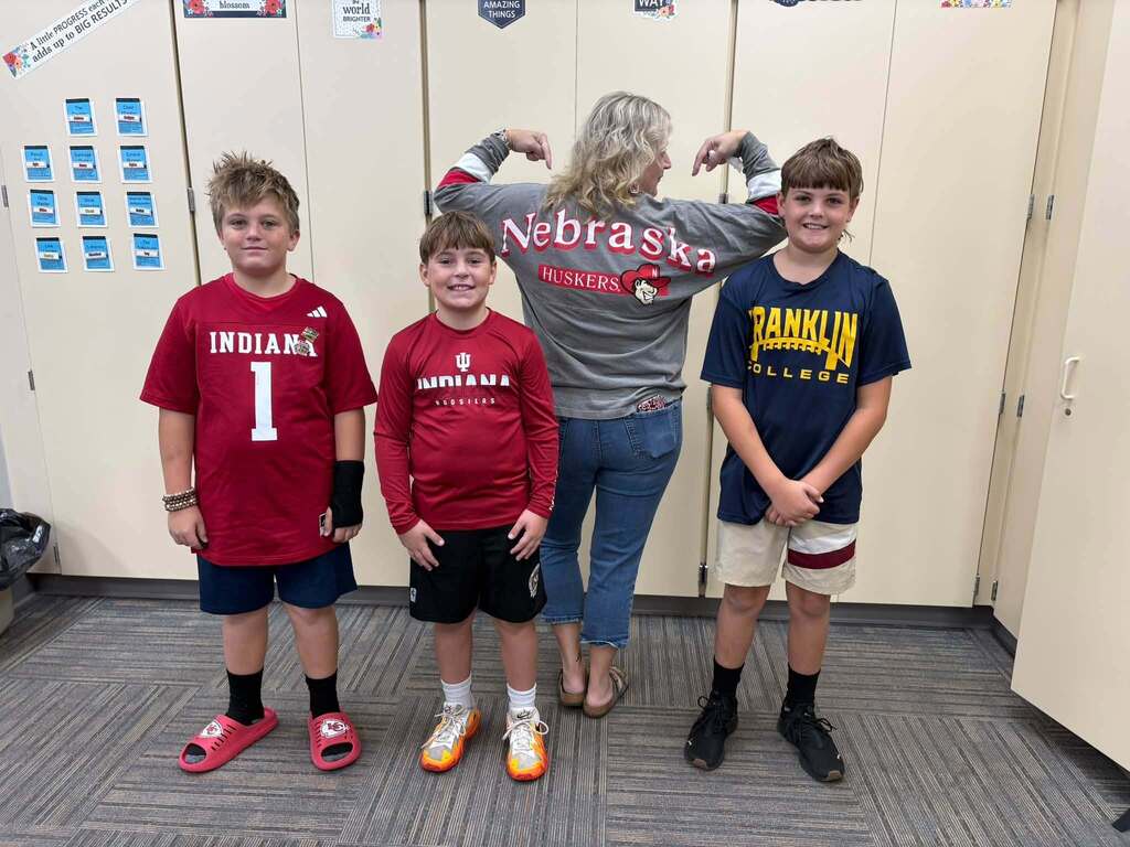 teacher and students with college clothes