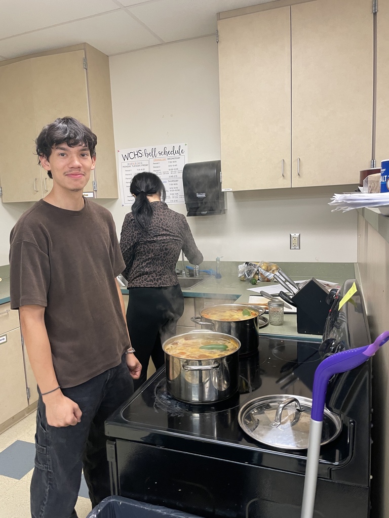 boy with pot on stove