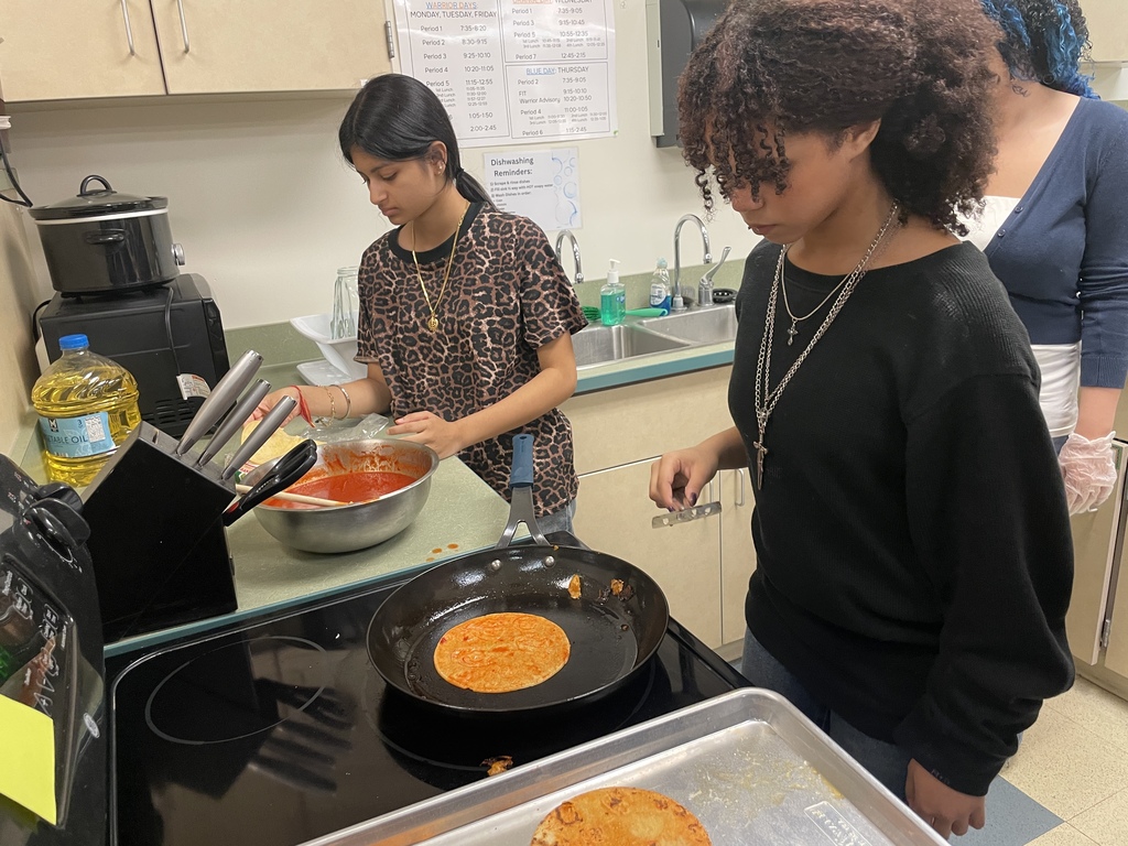 girls cooking on stove