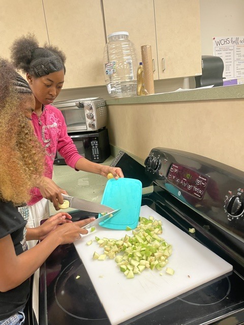 students chopping foood