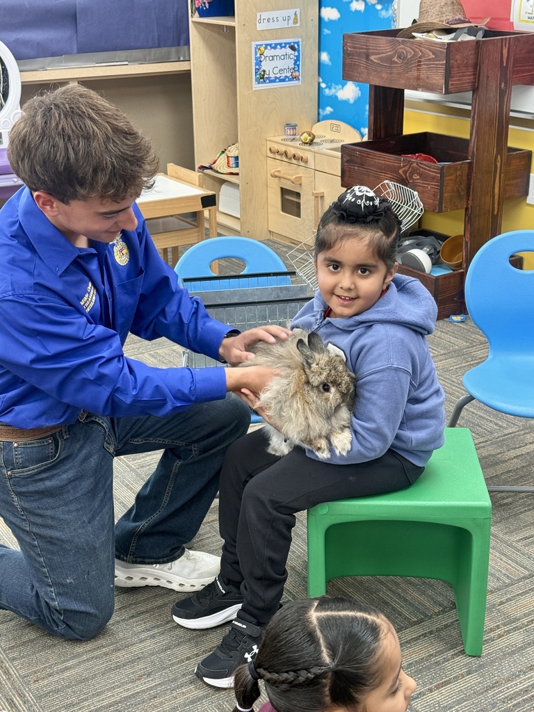 student holding rabbit