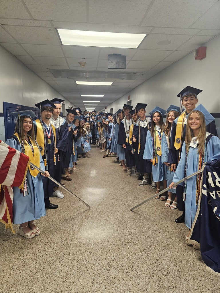Students in a hallway celebrating graduation