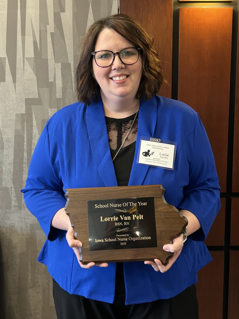 Lorrie holding award