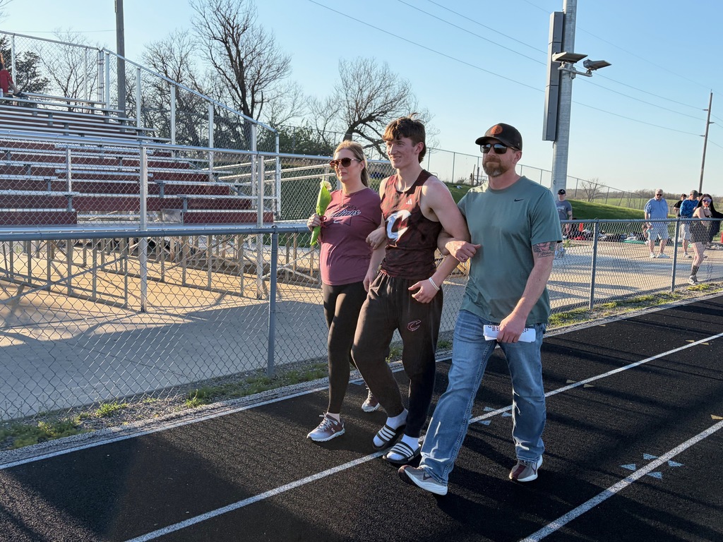 Gavin and parents walking in