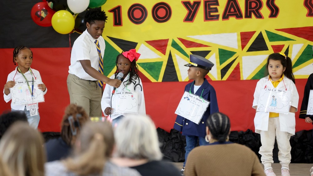 Students  presenting at Black History Month celebration