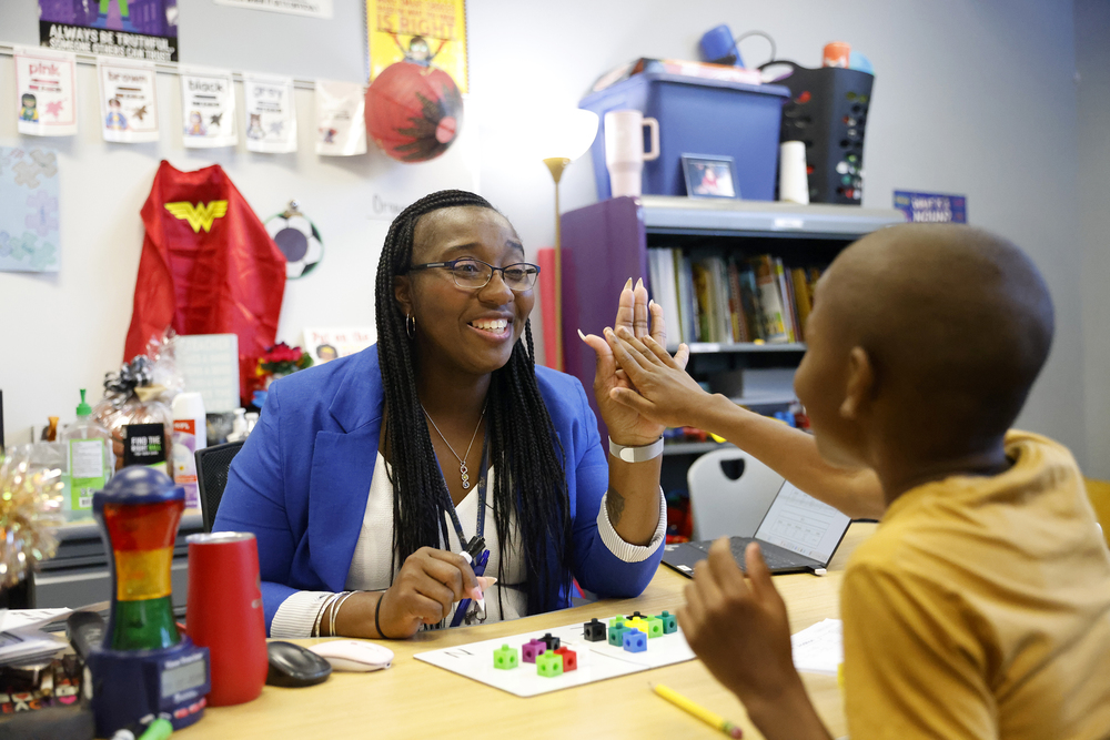 Teacher and student high-five
