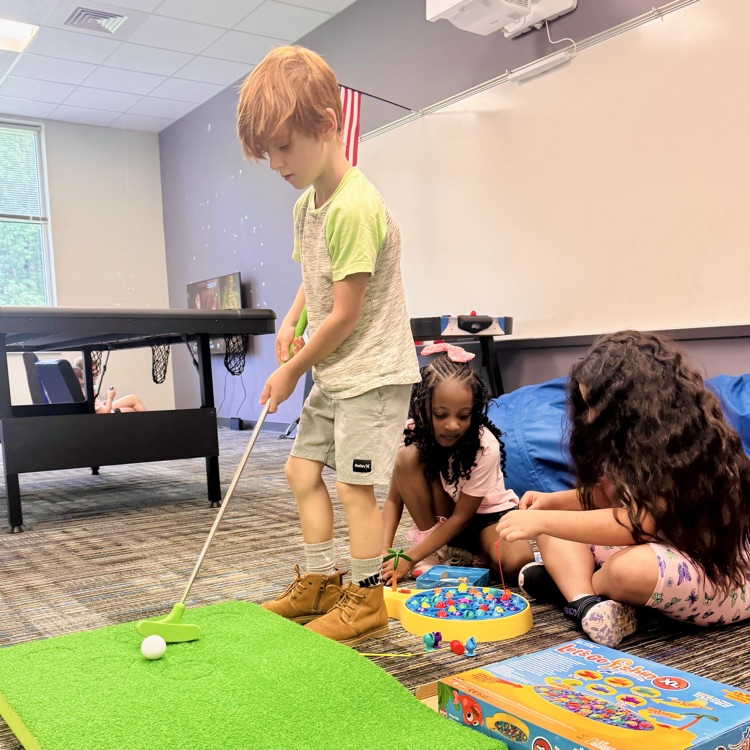 a boy plays golf
