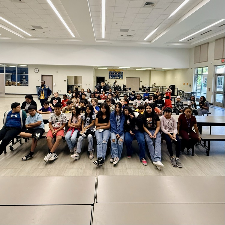 students watching their peers
