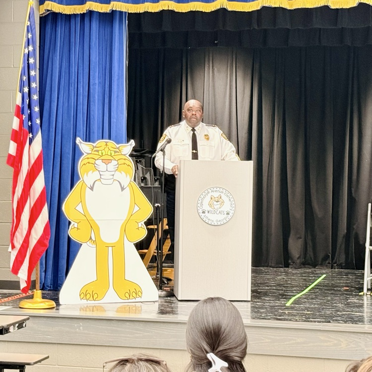 an officer addresses the crowd