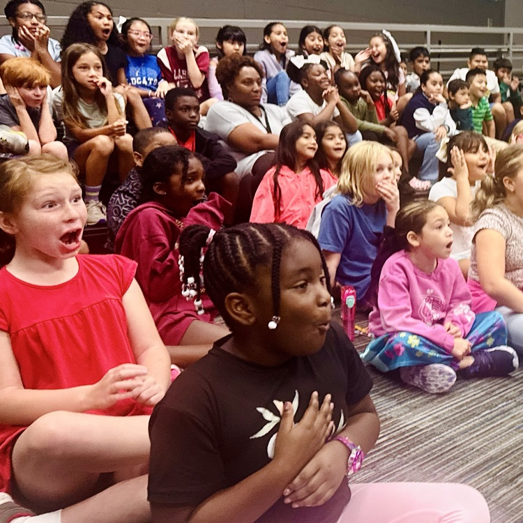 children reacting with shock and amazement