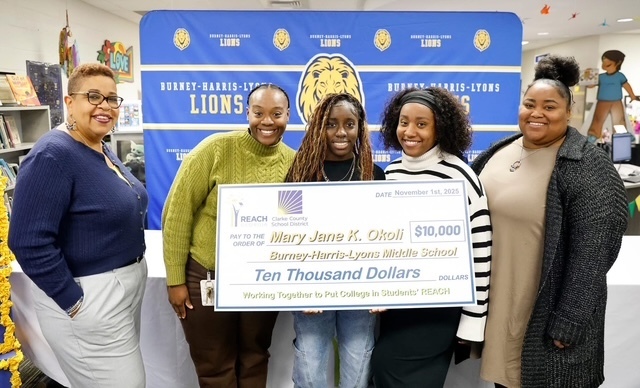 Our student signing for the 2025 GA Reach Scholarship. 