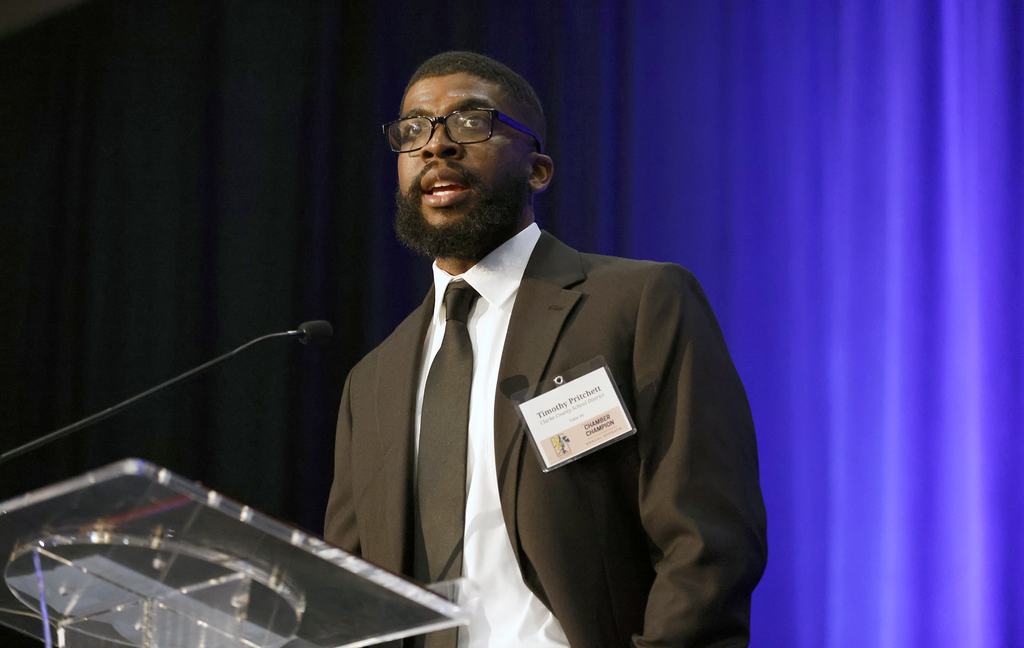 Pritchett speaking to audience