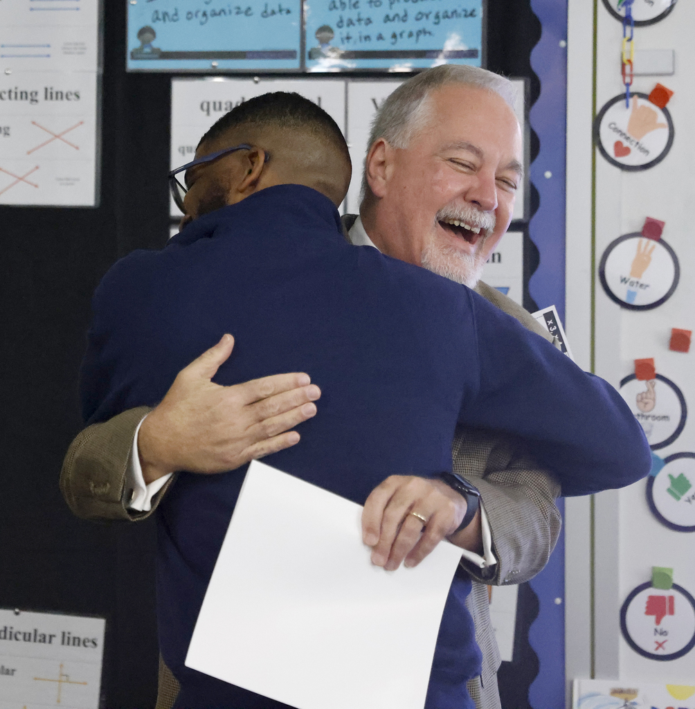 Pritchett hugging Woods