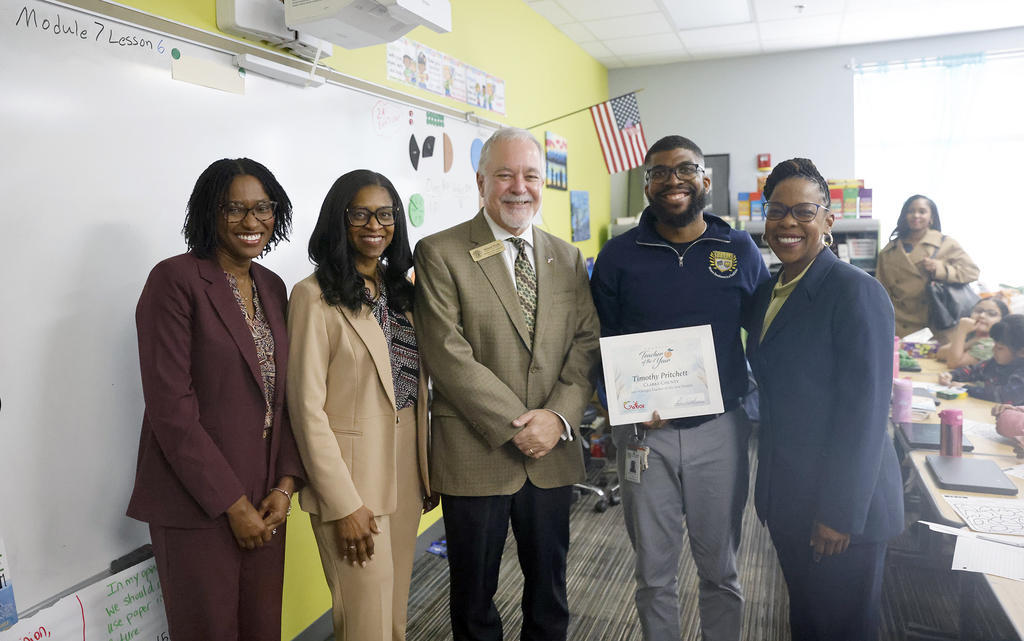 Pritchett with Woods and school and district leaders