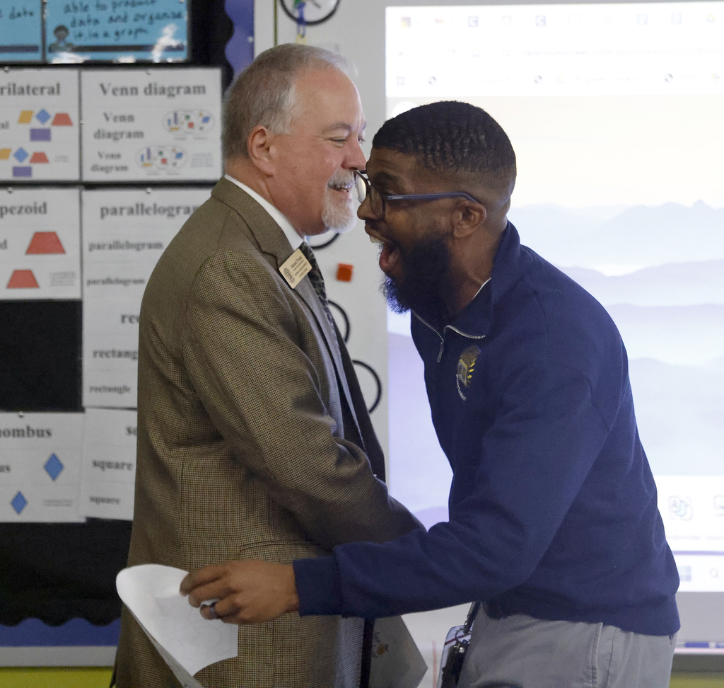 Pritchett reacting to announcement in surprise