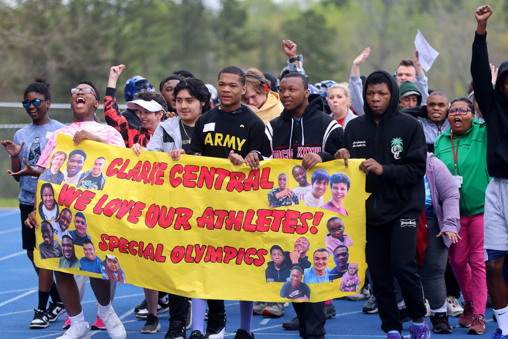 Special Olympics group with banner