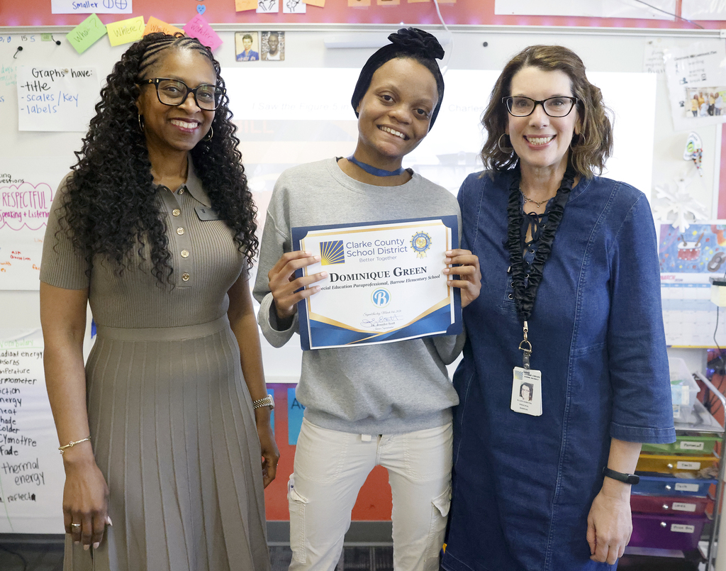 Employee of the Month Dominique Green with Interim Superintendent Dr. Jennifer Scott and Barrow Elementary Principal Dr. Ellen Sabatini