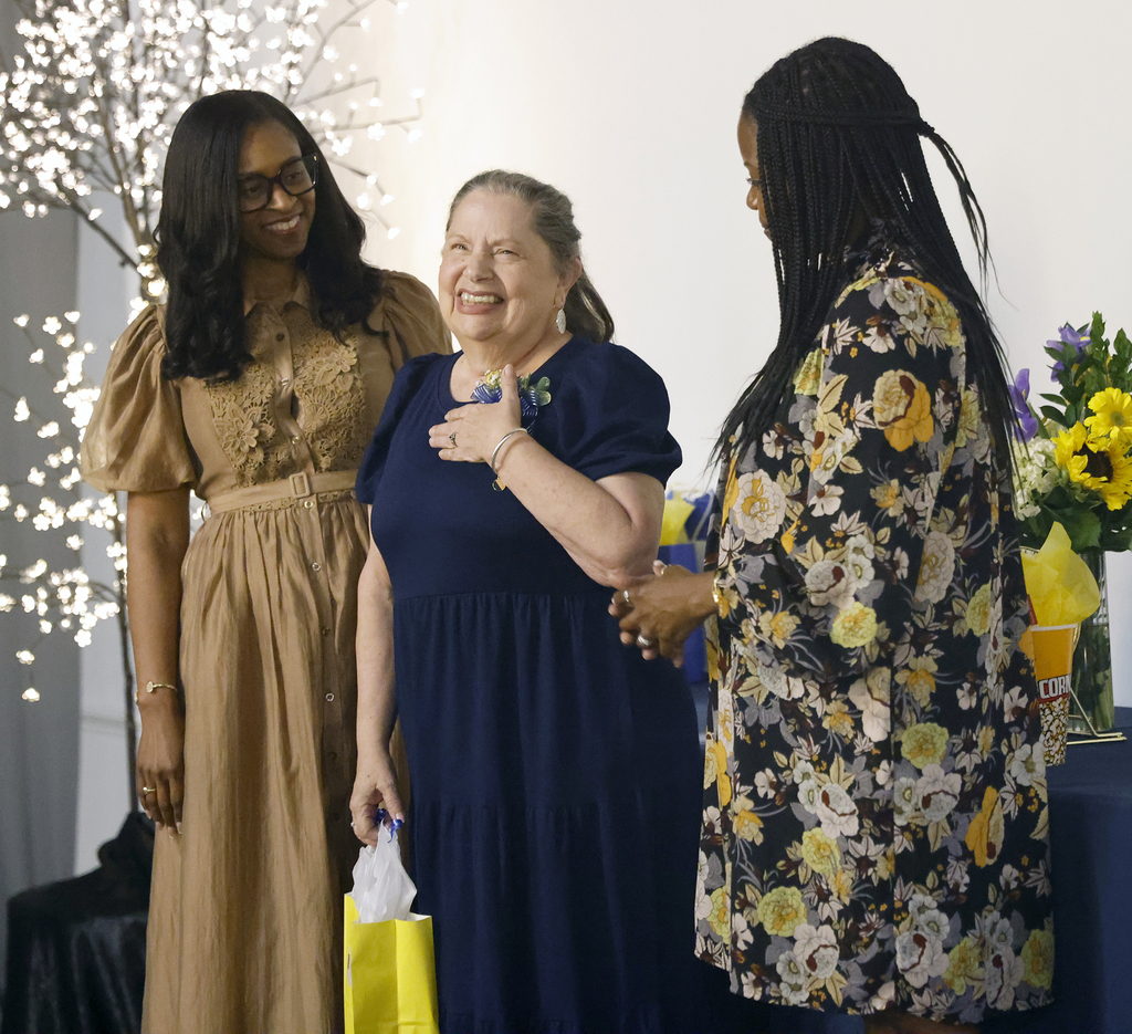 Retiree celebrating with Interim Superintendent and School Board President