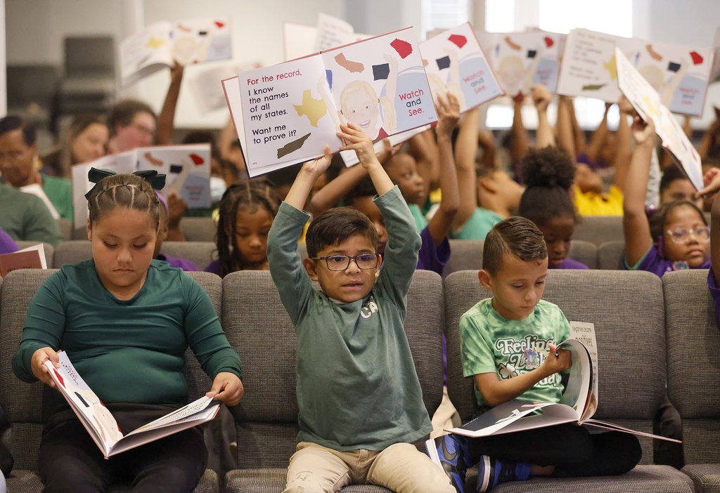 Students holding books
