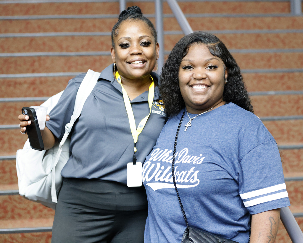 Two school employees smiling