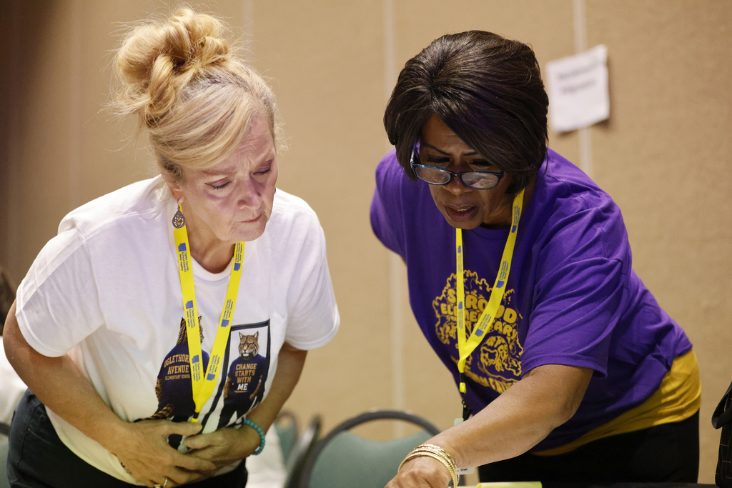 Two teachers working together during session