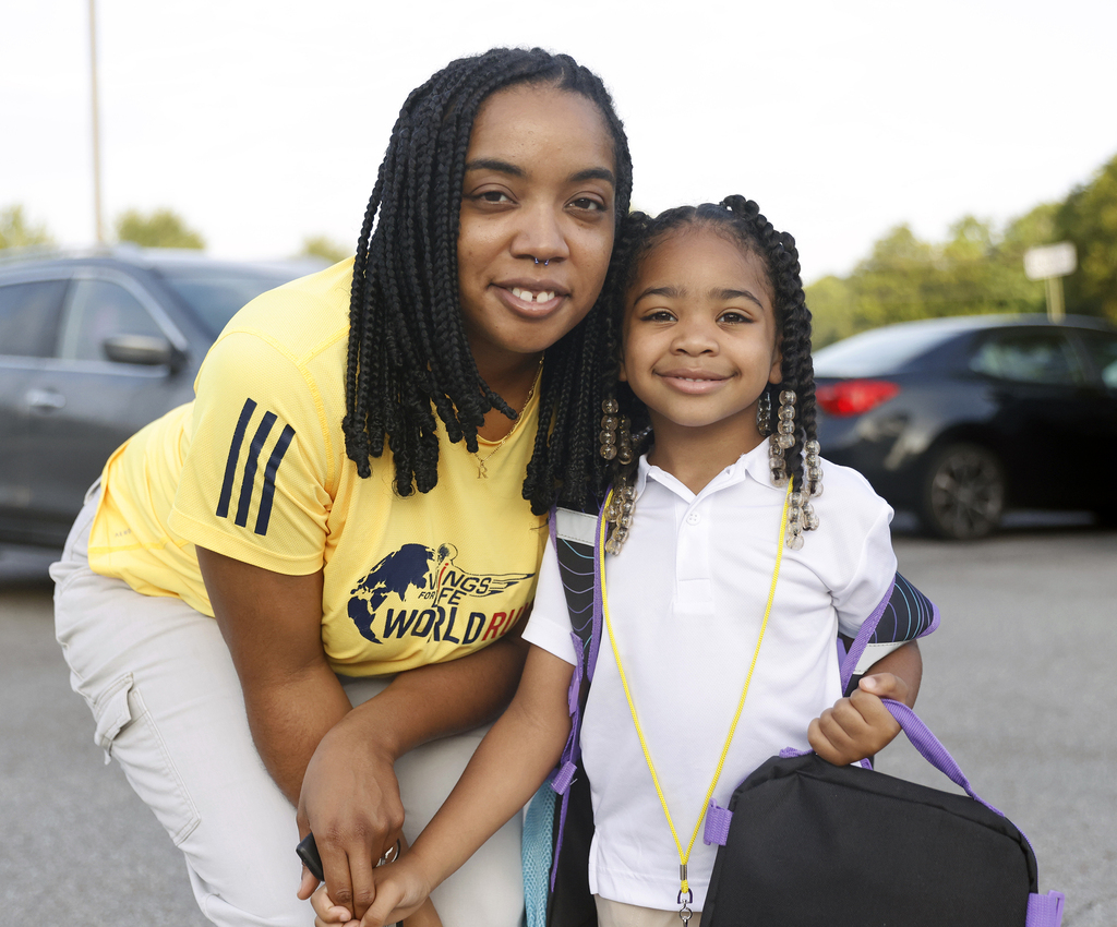 Mother and daughter smiling