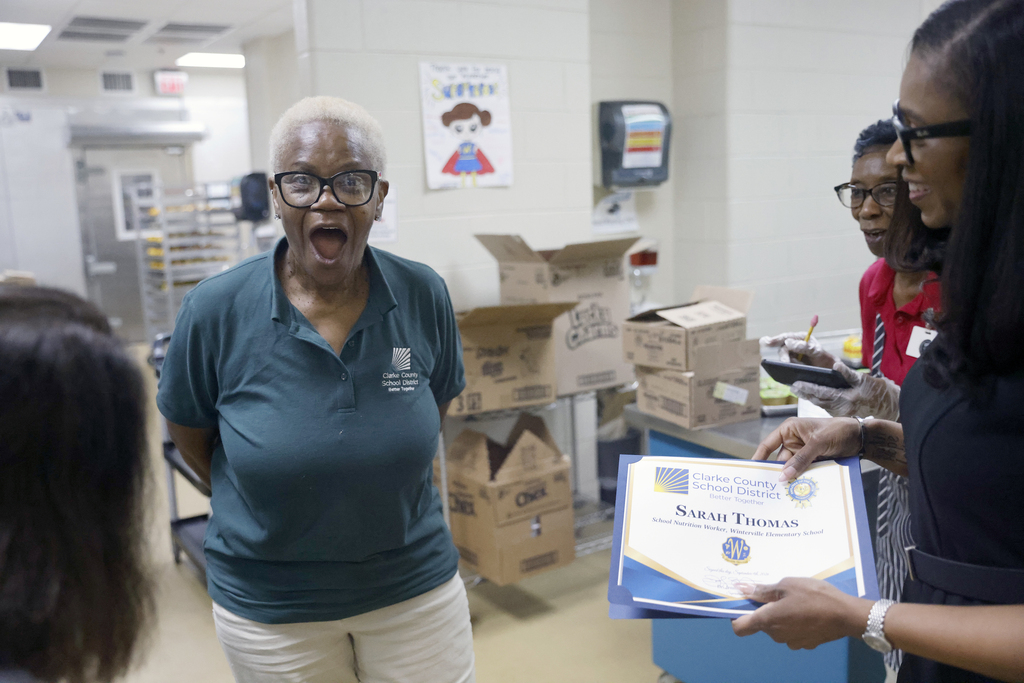 Employee of the Month being surprised with the award