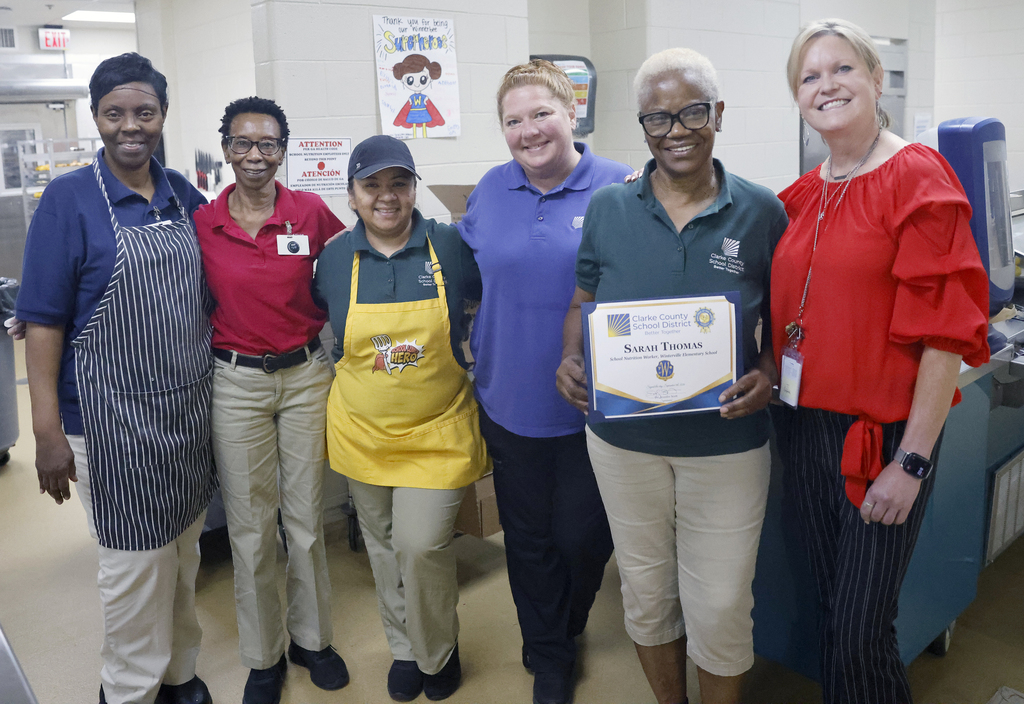 Employee of the Month with principal and school nutrition team