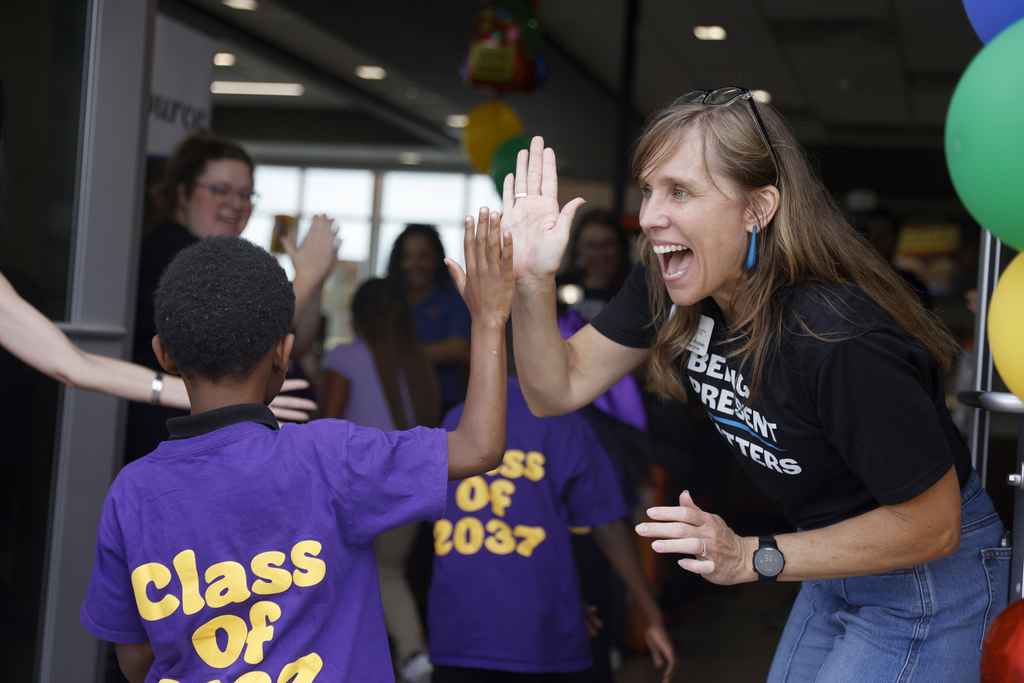 FC-CIS team members greeting students