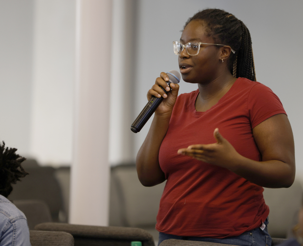 Student speaking to large group