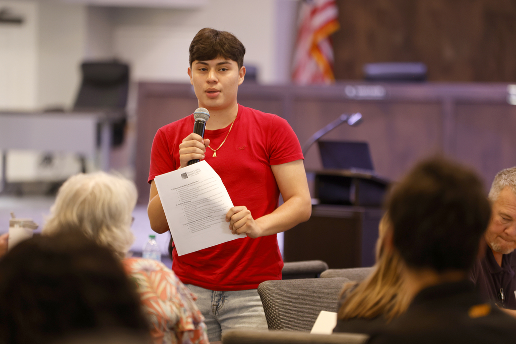 Student speaking to large group