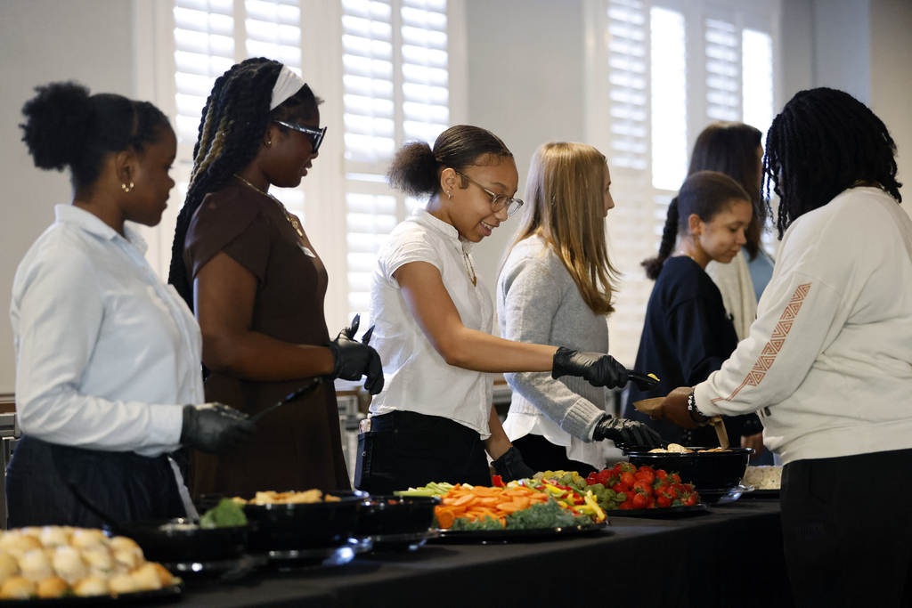 Hilsman Middle School eighth-graders serving food during reception