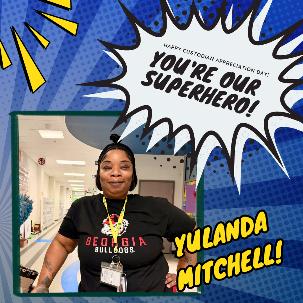 Ms. Yulanda poses smiling in a hallway