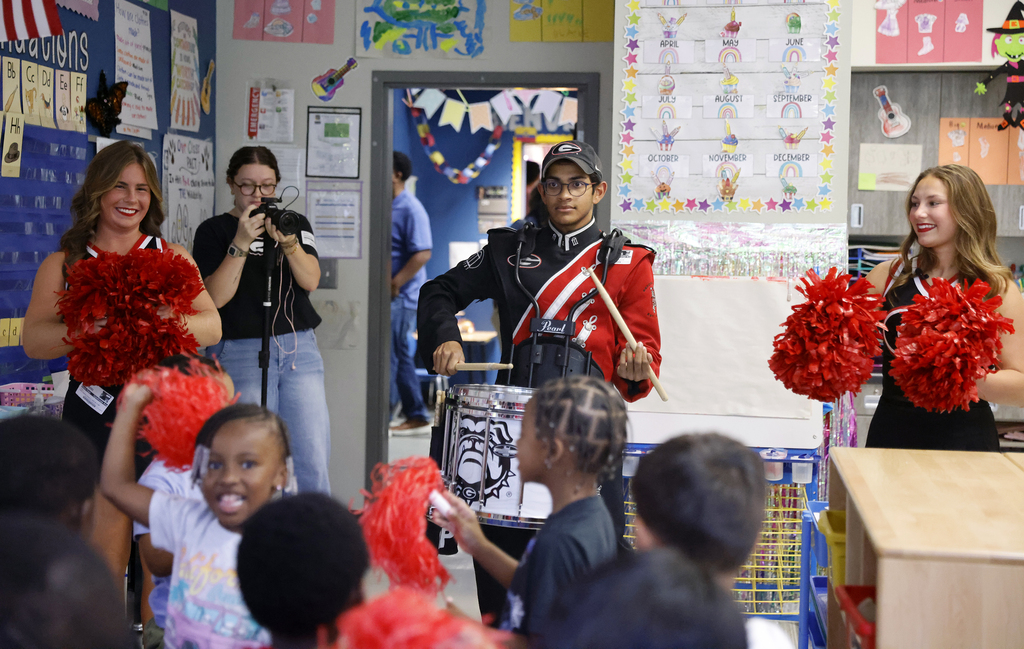 UGA Redcoat Band drummer drumming for students