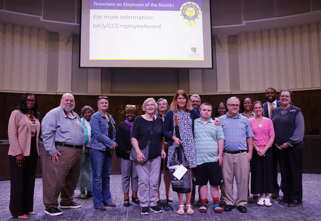 Employee of the Month with family, supporters, Superintendent, and school board