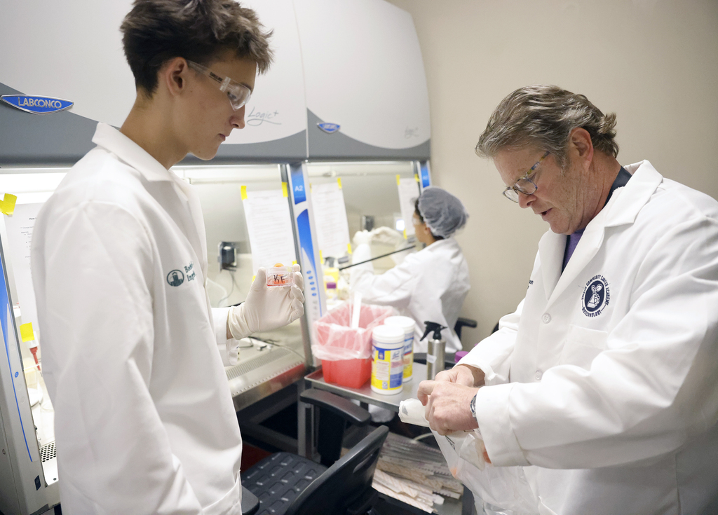 Advanced biomanufacturing student working in lab with teacher