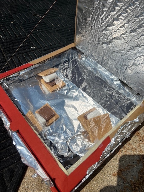 Mr. Brummer’s science class worked on a STEM project to design and build solar ovens this week. They used pizza boxes, foil, plastic wrap, and other materials to create solar ovens that could reach temps of 160 to 200 degrees Fahrenheit! Today they put them to use and made some s’mores using the power of the sun.