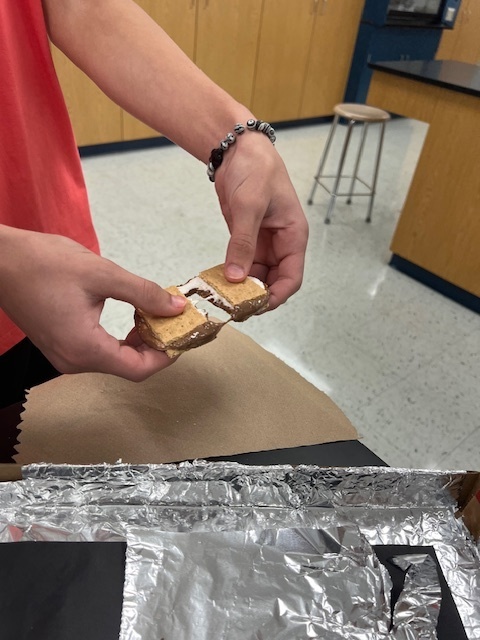 Mr. Brummer’s science class worked on a STEM project to design and build solar ovens this week. They used pizza boxes, foil, plastic wrap, and other materials to create solar ovens that could reach temps of 160 to 200 degrees Fahrenheit! Today they put them to use and made some s’mores using the power of the sun.
