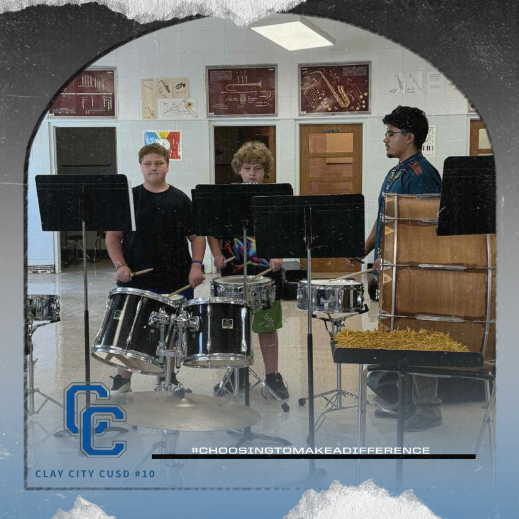 Eighth graders Zarik and Zaylin practice the drums as Mr. Miranda looks on. Clay City is excited to have the band back!