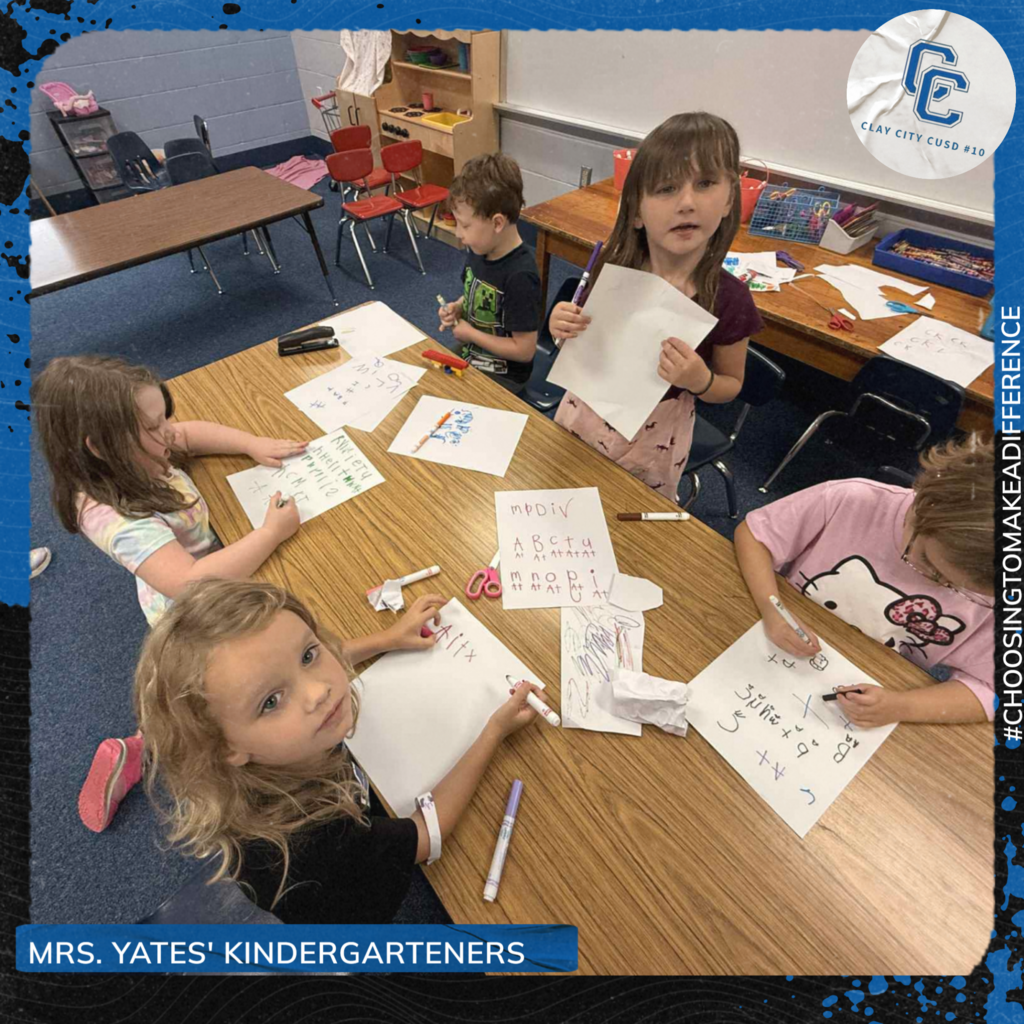 Some of Mrs. Yates' kindergarteners work on writing their letters during center time. Great job kids!