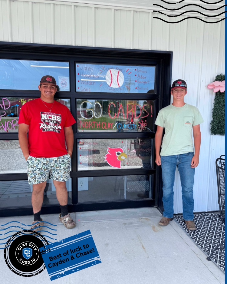 Recent graduate Cayden Craig and freshman Chase Bangert stopped by The Scoop to snag a photo with the window art. Good luck in tomorrow's sectional game boys!