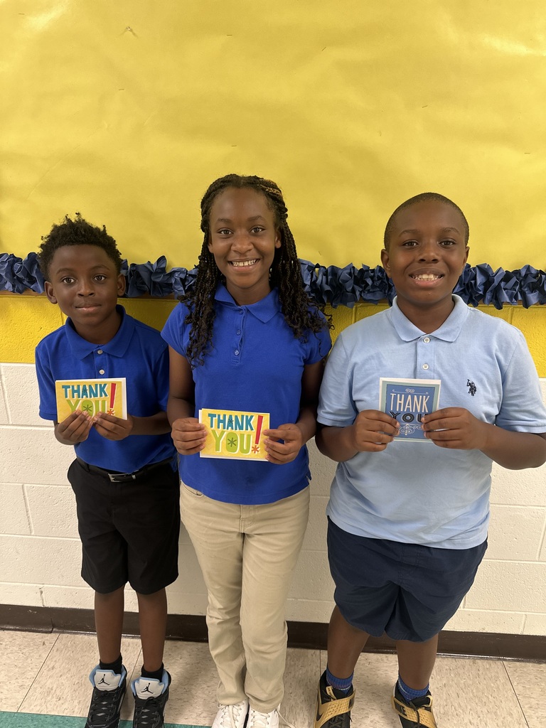 Literacy bus activity report winners, Kylan Jones (4th), Anaya Offord (4th), Maxwell Gilbert (5th)