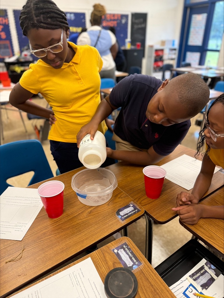 5th Graders investigating rain erosion