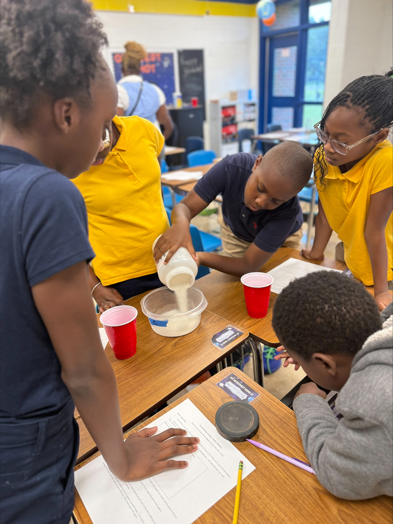 5th Graders investigating rain erosion