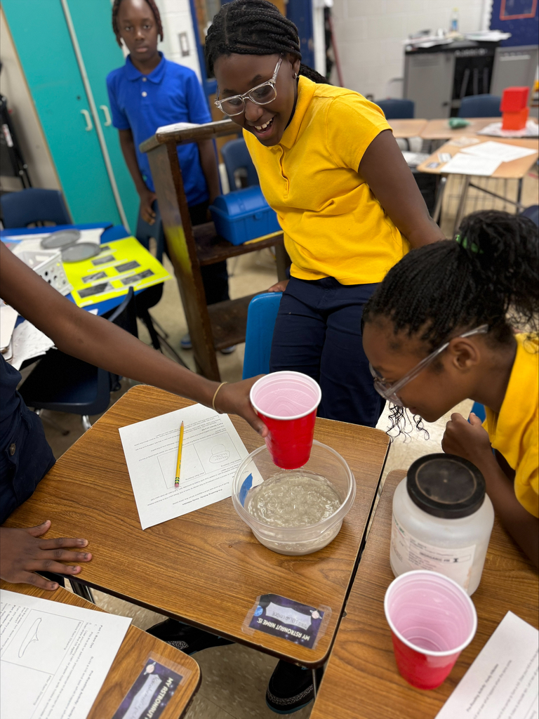 5th Graders investigating rain erosion