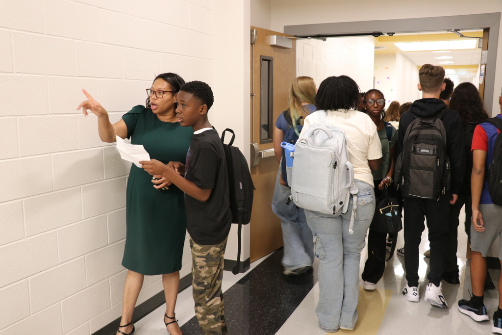 Principal helping students find their classroom