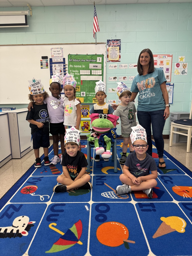 Pre-K class poses with Ms. Bush.
