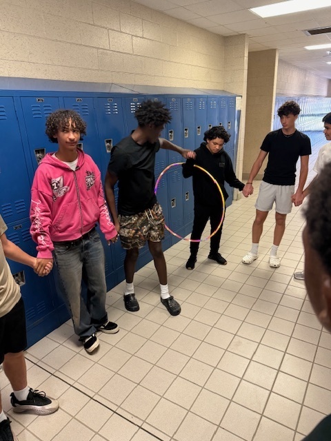 Ms. LaPierre’s class, students took on a fun teamwork challenge! 🤝 Working in a circle and holding hands, they had to pass a hula hoop all the way around without breaking the chain. The activity required communication, problem-solving, and cooperation. Afterwards, the class reflected on how teamwork is essential—both in the kitchen and in life.